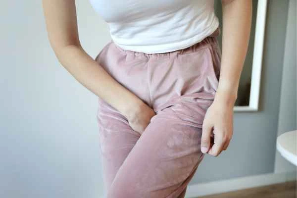 woman running for the toilet because of urinary incontinence Crawley